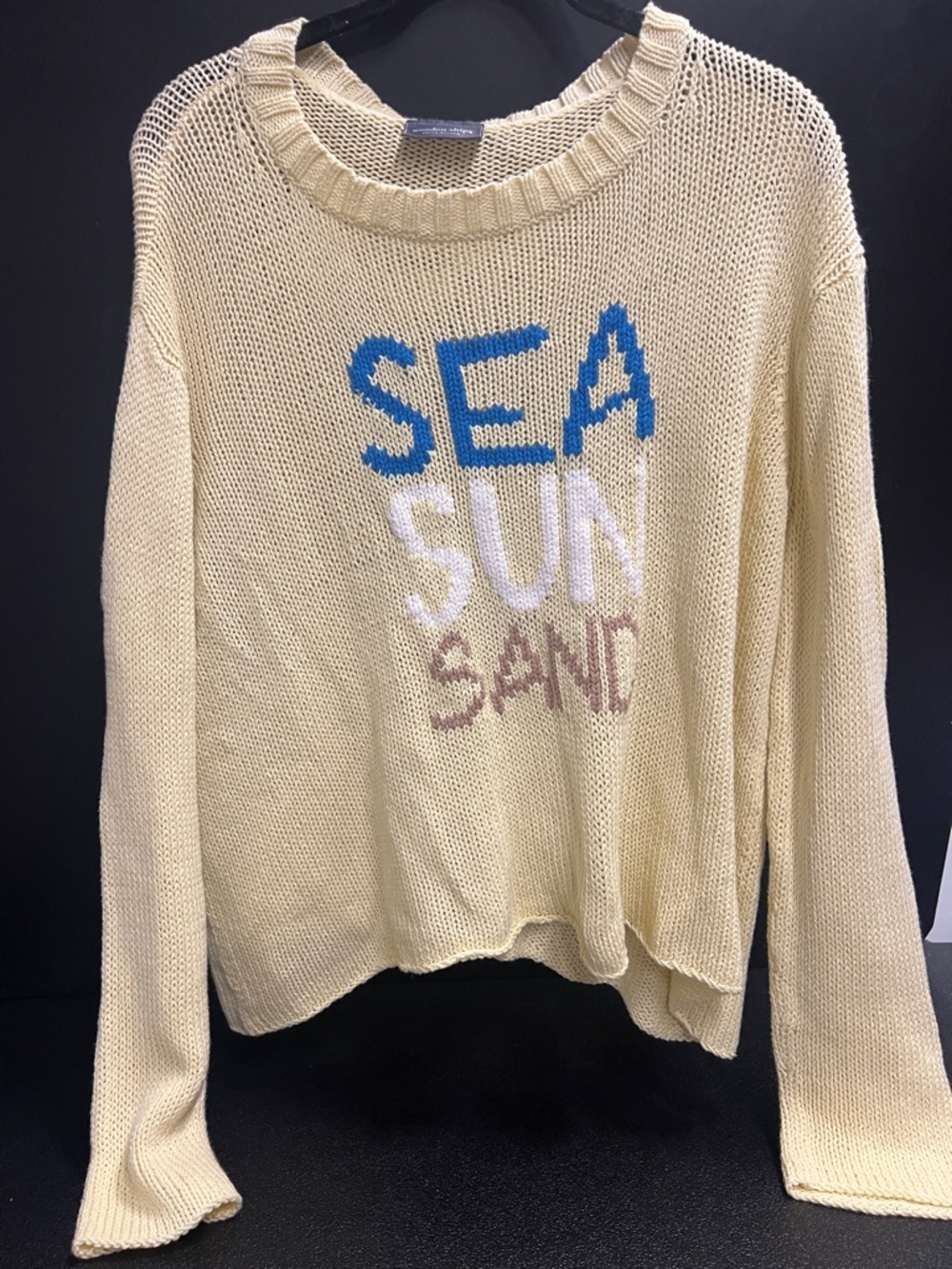 Wooden Ships Cream Knit Crewneck Sweater with Blue, White & Tan Text